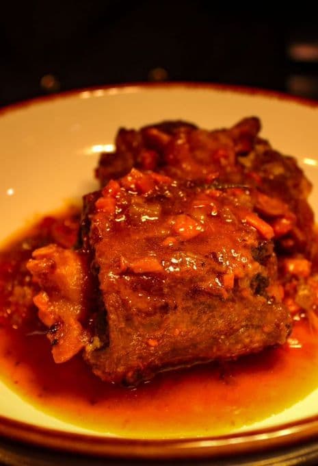 Coda alla Vaccinara — braised oxtail, candlelit