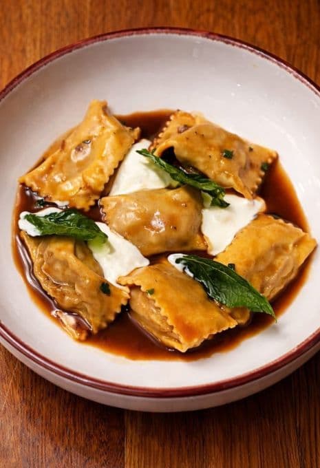 Pig head tortellini in chicken consommé